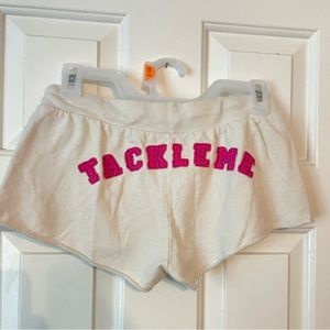 White shorts “tackle me” on bottom